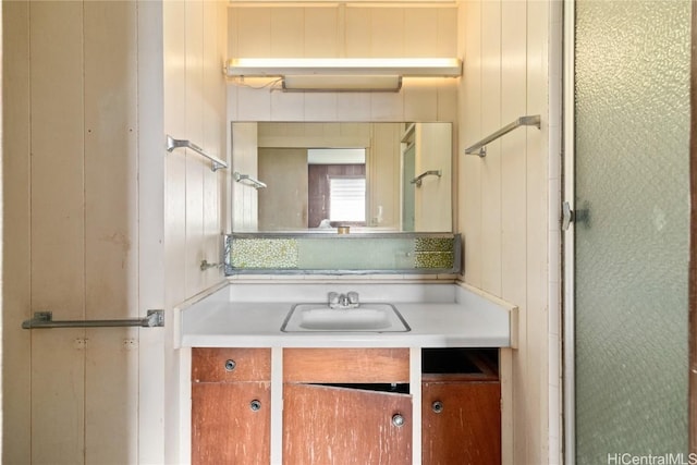 bathroom featuring vanity and an enclosed shower