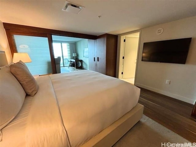 bedroom featuring hardwood / wood-style flooring