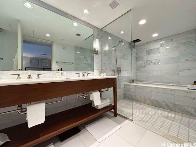 bathroom featuring vanity, tile patterned floors, and walk in shower