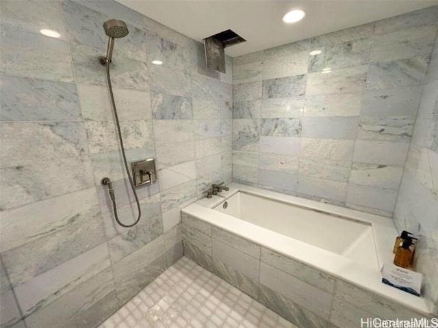 bathroom with a tile shower