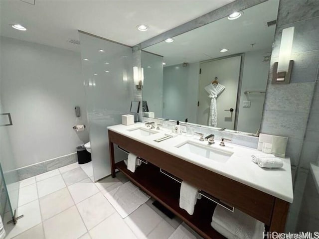 bathroom with vanity, tile patterned floors, and toilet