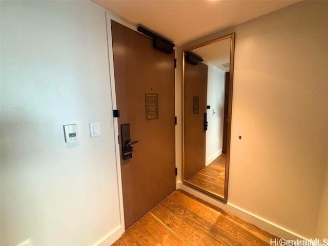 hallway featuring light hardwood / wood-style flooring