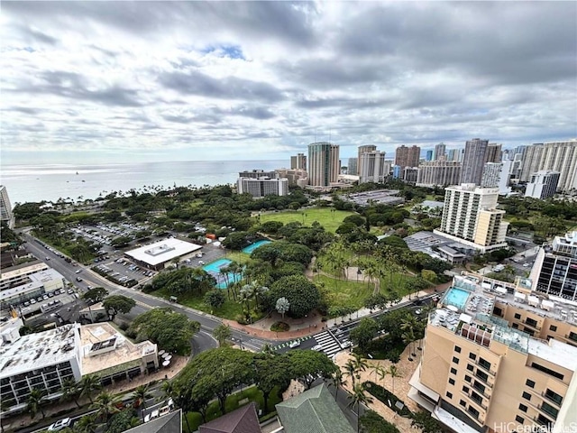 birds eye view of property with a water view