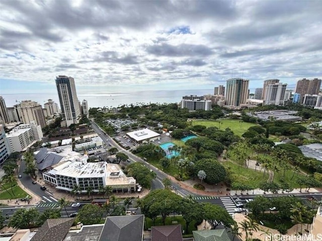 birds eye view of property with a water view