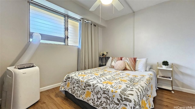 bedroom featuring wood-type flooring and ceiling fan