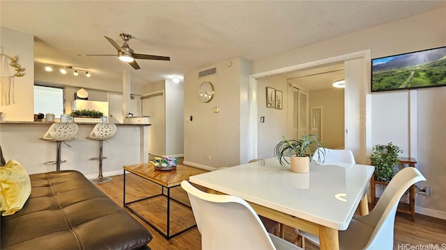 dining room featuring hardwood / wood-style floors and ceiling fan