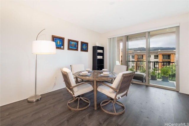 dining space with dark hardwood / wood-style floors