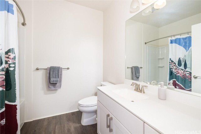 full bathroom with vanity, hardwood / wood-style flooring, shower / bath combination with curtain, and toilet