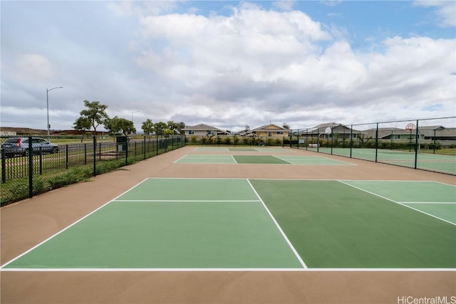 view of sport court featuring basketball hoop