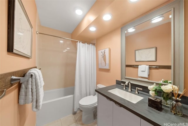 full bathroom with tile patterned flooring, vanity, shower / tub combo, and toilet