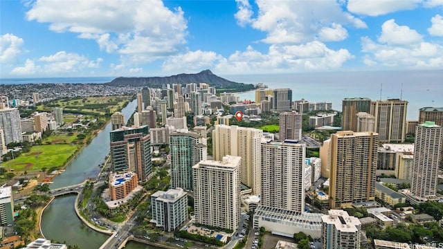 property's view of city featuring a water and mountain view