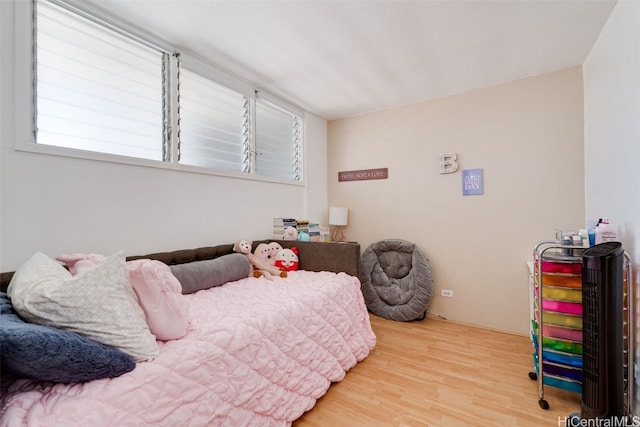 bedroom featuring hardwood / wood-style floors