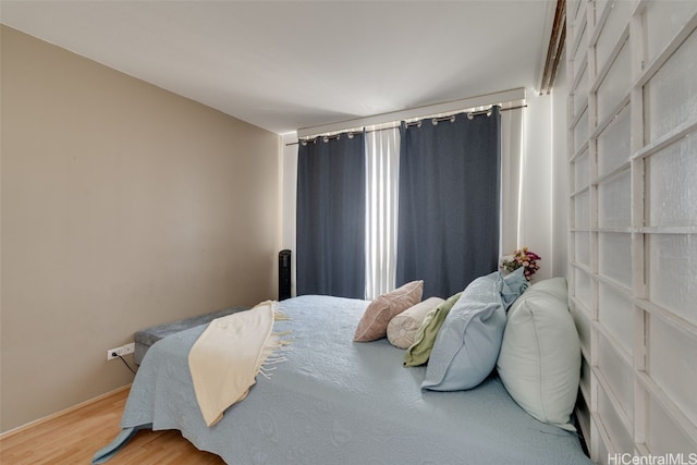 bedroom featuring hardwood / wood-style flooring