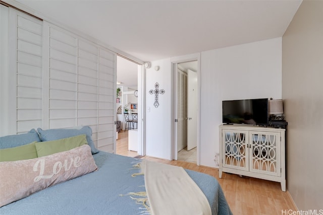 bedroom with light hardwood / wood-style flooring