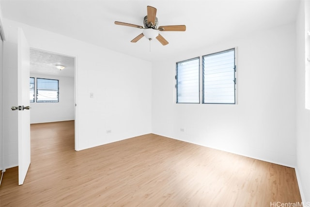 spare room with ceiling fan and light hardwood / wood-style flooring