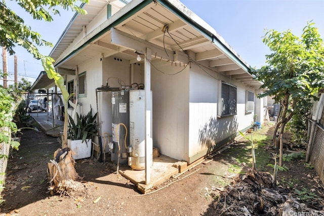 view of side of home featuring water heater