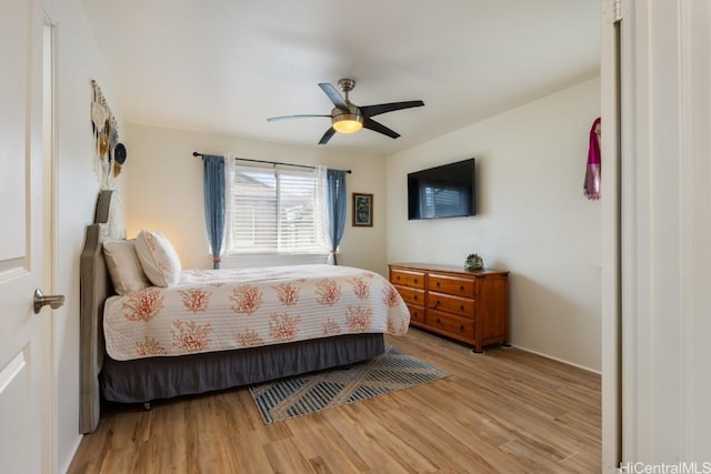 bedroom with ceiling fan and light wood-type flooring