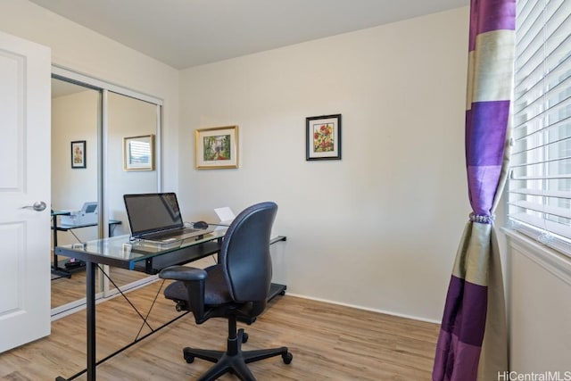 office space with light hardwood / wood-style floors