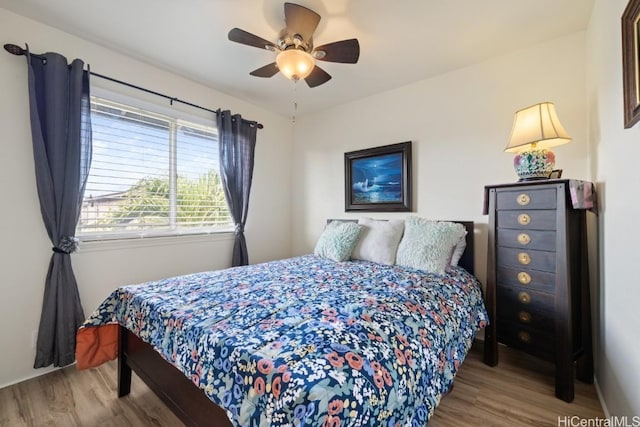 bedroom featuring ceiling fan and light wood-type flooring