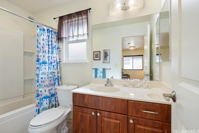 full bathroom with vanity, shower / bath combination with curtain, and toilet