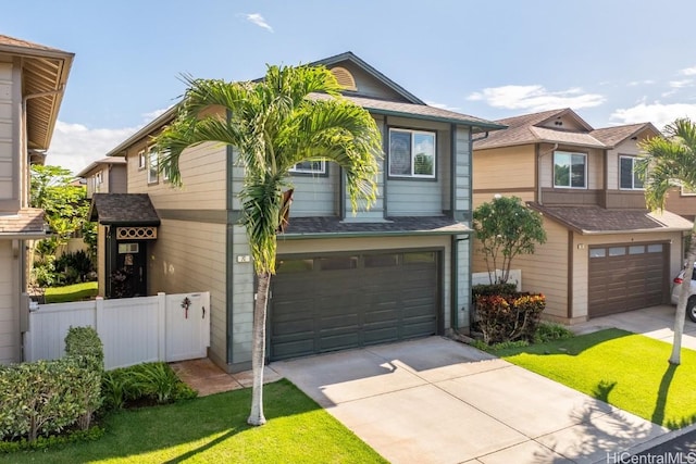 view of front of property featuring a garage and a front lawn