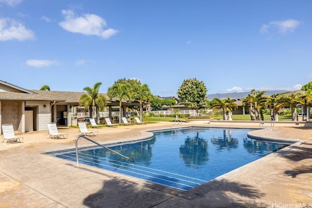 view of swimming pool featuring a patio