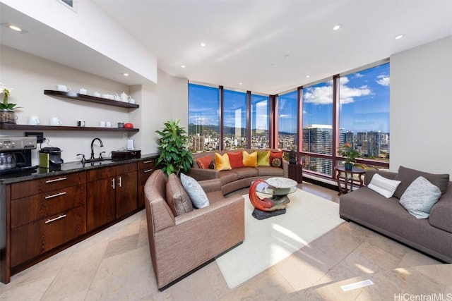 living room with wet bar and a wall of windows