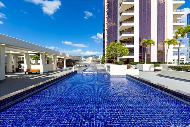 view of swimming pool with a patio area