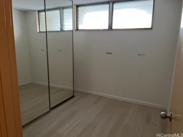 interior space with light hardwood / wood-style floors and a closet