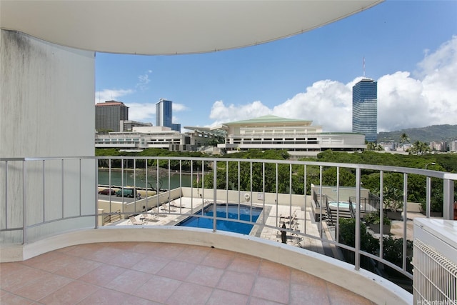1717 Ala Wai Blvd Unit 505, Honolulu, HI 96815 - balcony featuring view of pool area, a water view, and a view of city