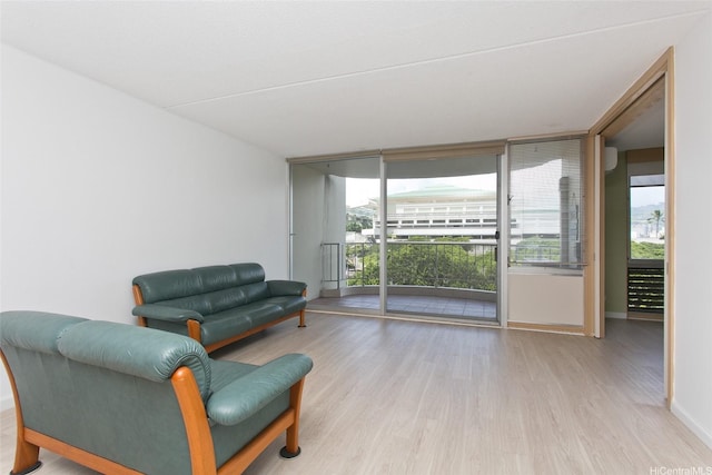 1717 Ala Wai Blvd Unit 505, Honolulu, HI 96815 - living area featuring wood finished floors and floor to ceiling windows