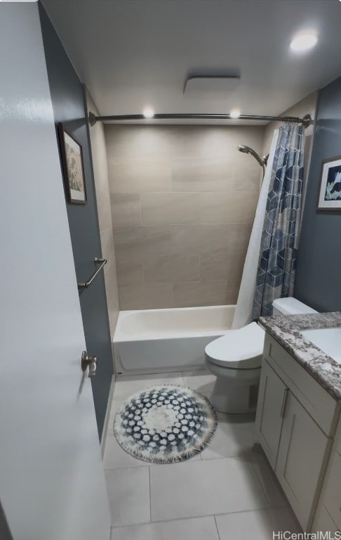 full bathroom with shower / bathtub combination with curtain, vanity, toilet, and tile patterned flooring