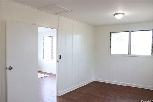 87-1894 Mohihi St, Waianae, HI 96792 - empty room featuring dark wood-style floors, plenty of natural light, baseboards, and attic access