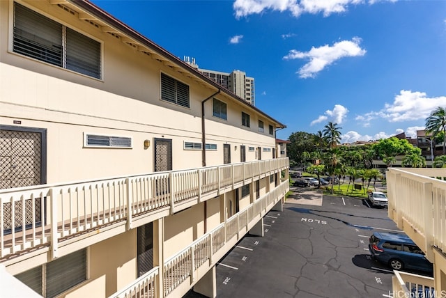 view of property with uncovered parking