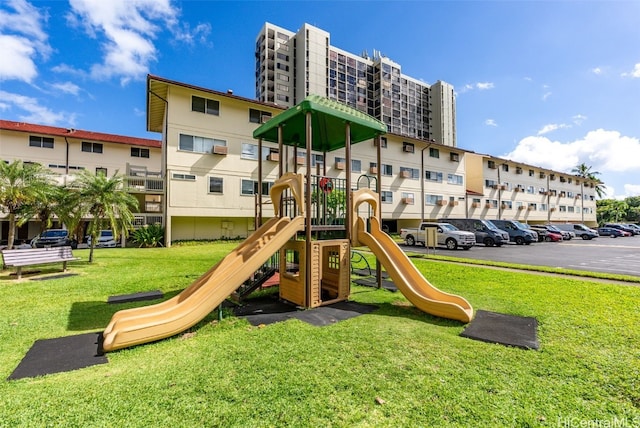 community jungle gym with a lawn