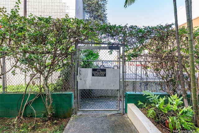 view of gate featuring fence