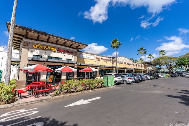 view of property with uncovered parking