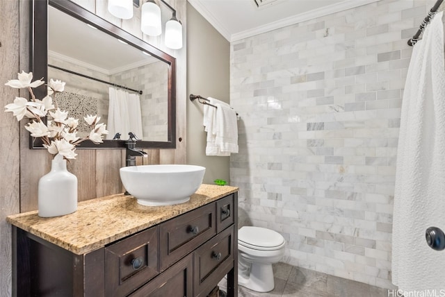 bathroom with toilet, curtained shower, vanity, and crown molding