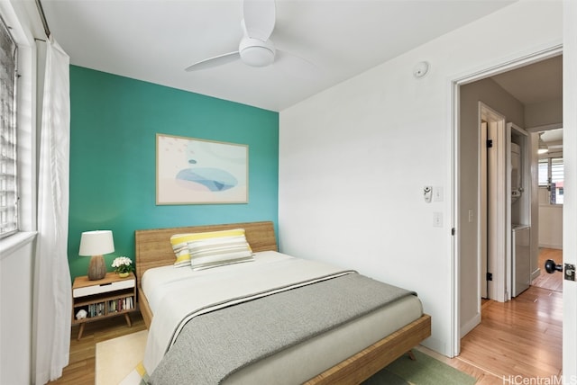 bedroom featuring ceiling fan and wood finished floors