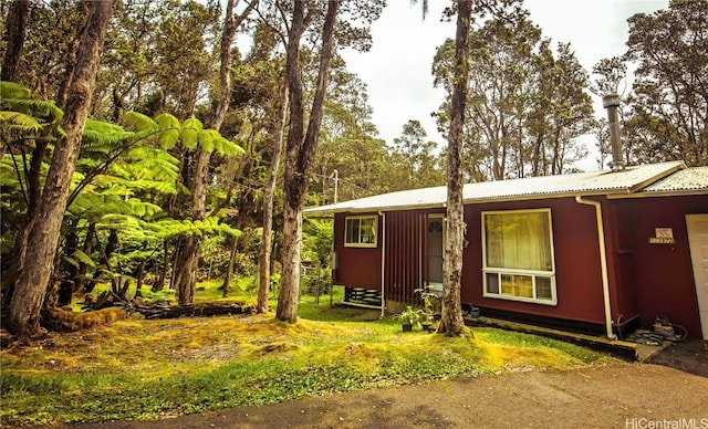 exterior space with metal roof