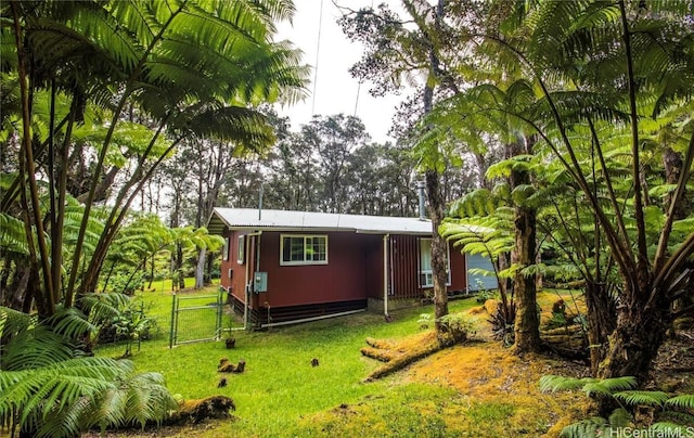 view of outbuilding with a gate and fence