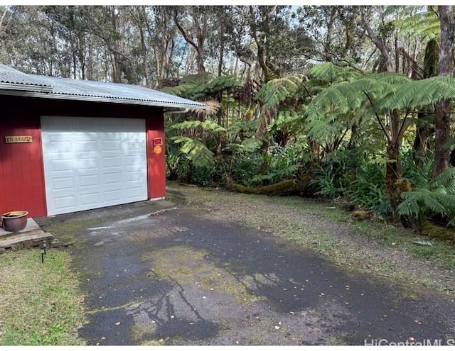 garage featuring driveway