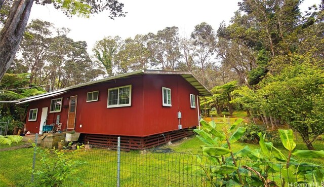 view of home's exterior featuring a yard