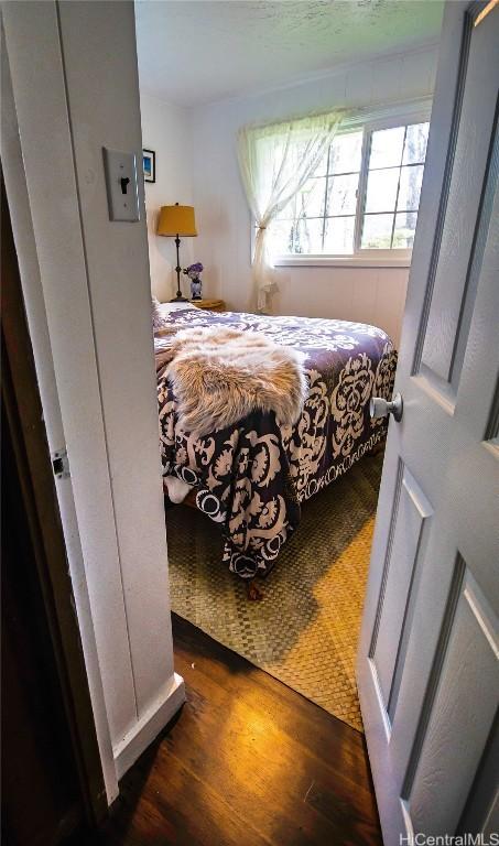 bedroom featuring dark wood-style floors