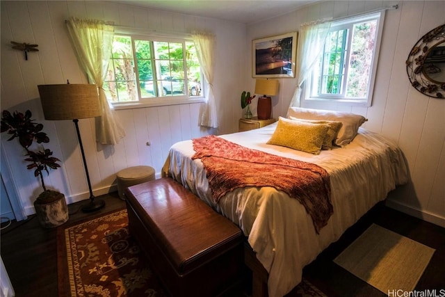 bedroom featuring dark wood finished floors