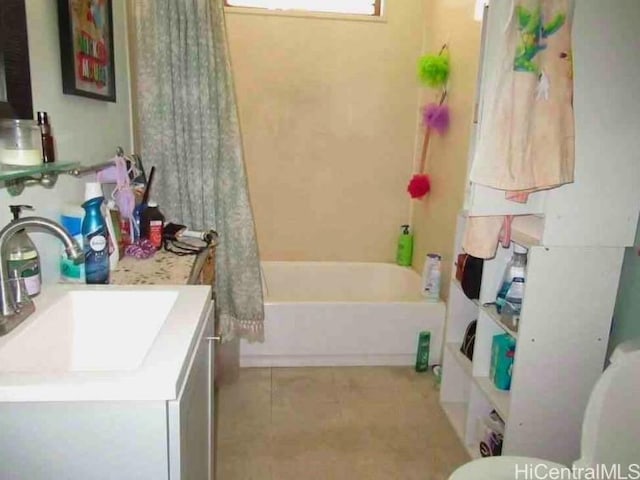 bathroom with vanity, shower / bathtub combination with curtain, and tile patterned floors