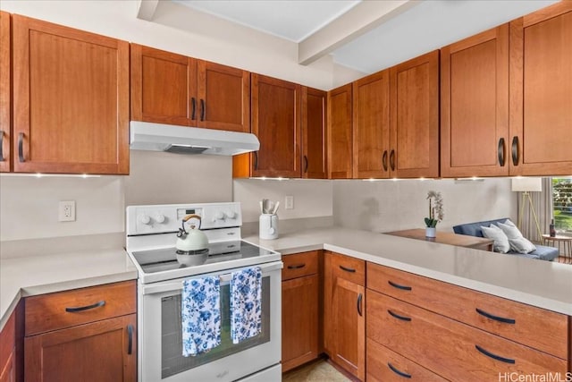 kitchen with beam ceiling and white electric range