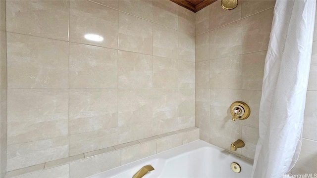 bathroom featuring shower / tub combo with curtain