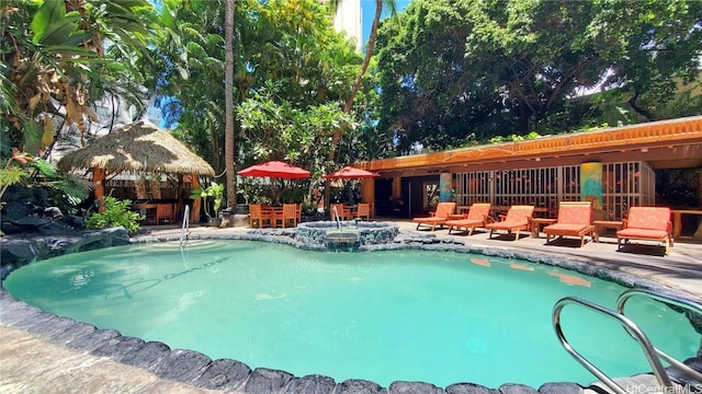 view of pool with a gazebo and a jacuzzi