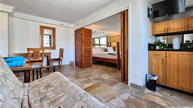 2425 Kuhio Ave Unit 1104, Honolulu, HI 96815 - bedroom with stone tile flooring, baseboards, and ornamental molding